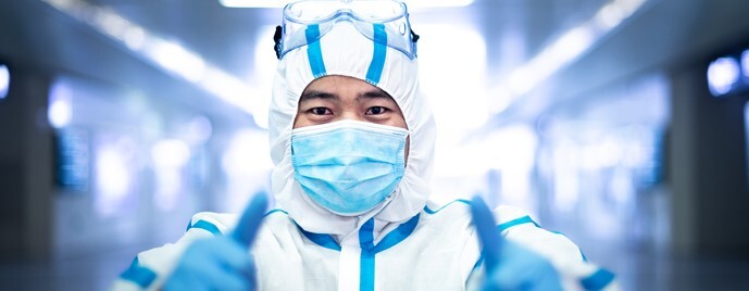 COVID-19 medical worker wearing protective clothing